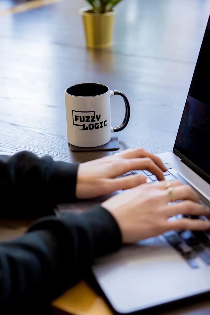 Writing a newsletter in Fuzzy Logic, with a Fuzzy Logic mug on the desk
